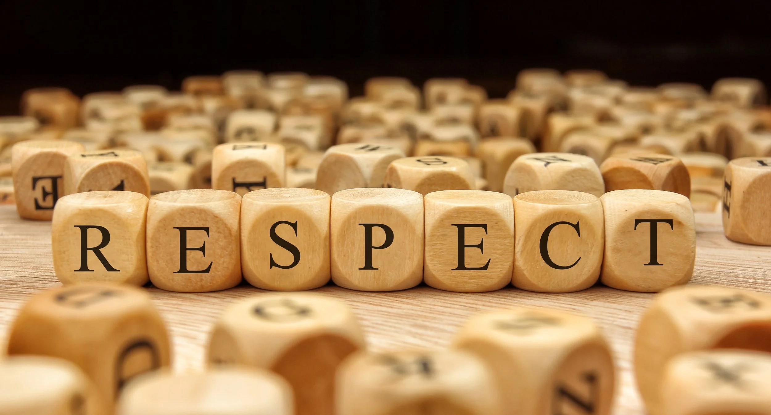 wooden blocks spell out the word 'respect'