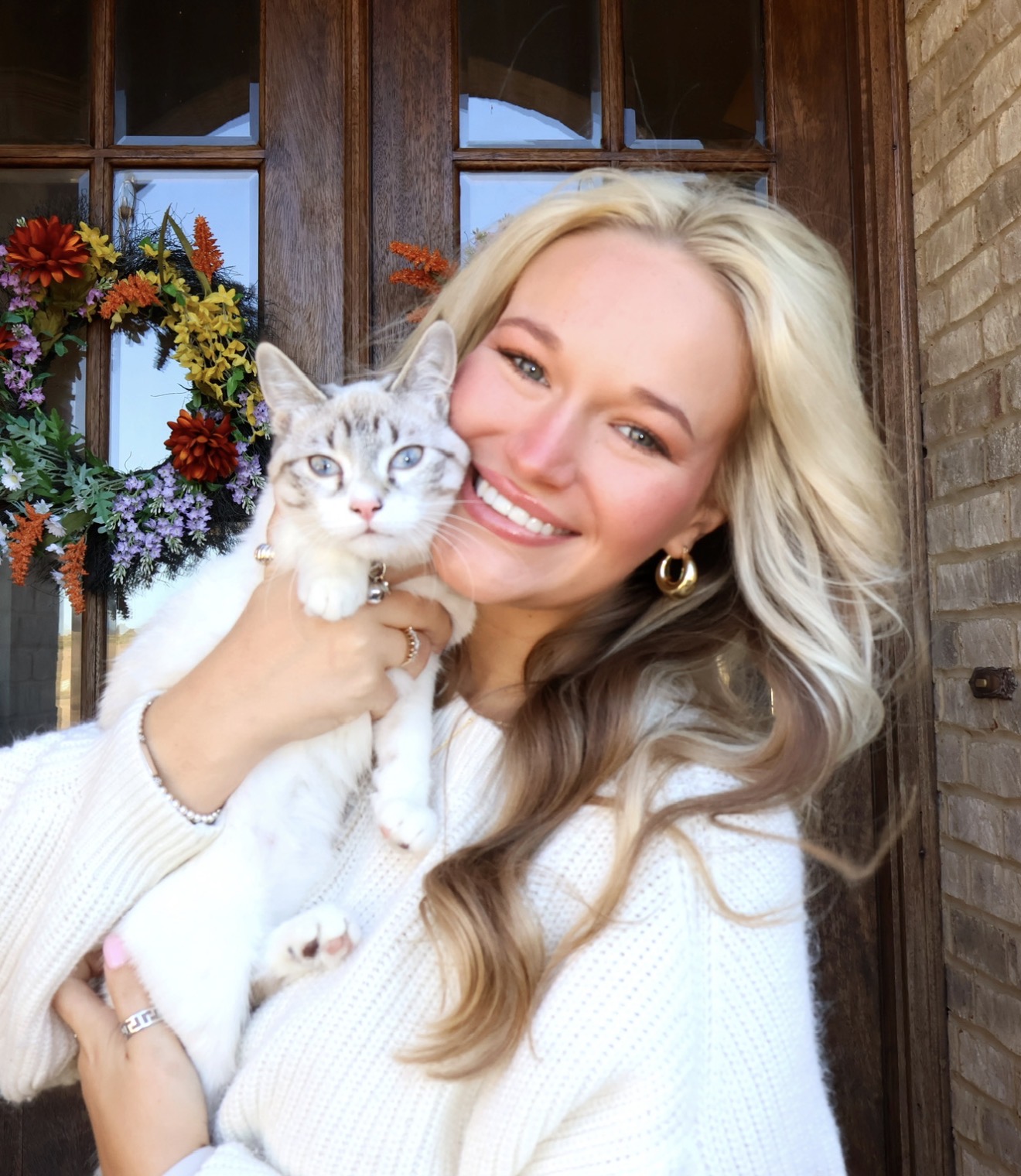 kaira-smiling-holding-cat