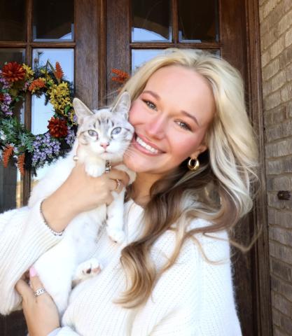 kaira-smiling-holding-cat